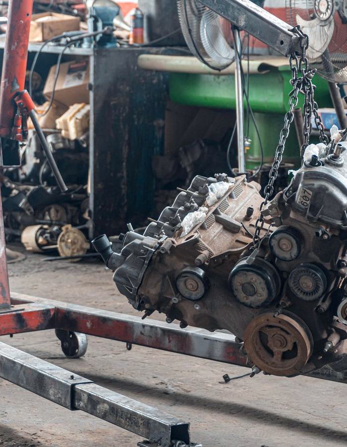 An engine on a stand in a workshop